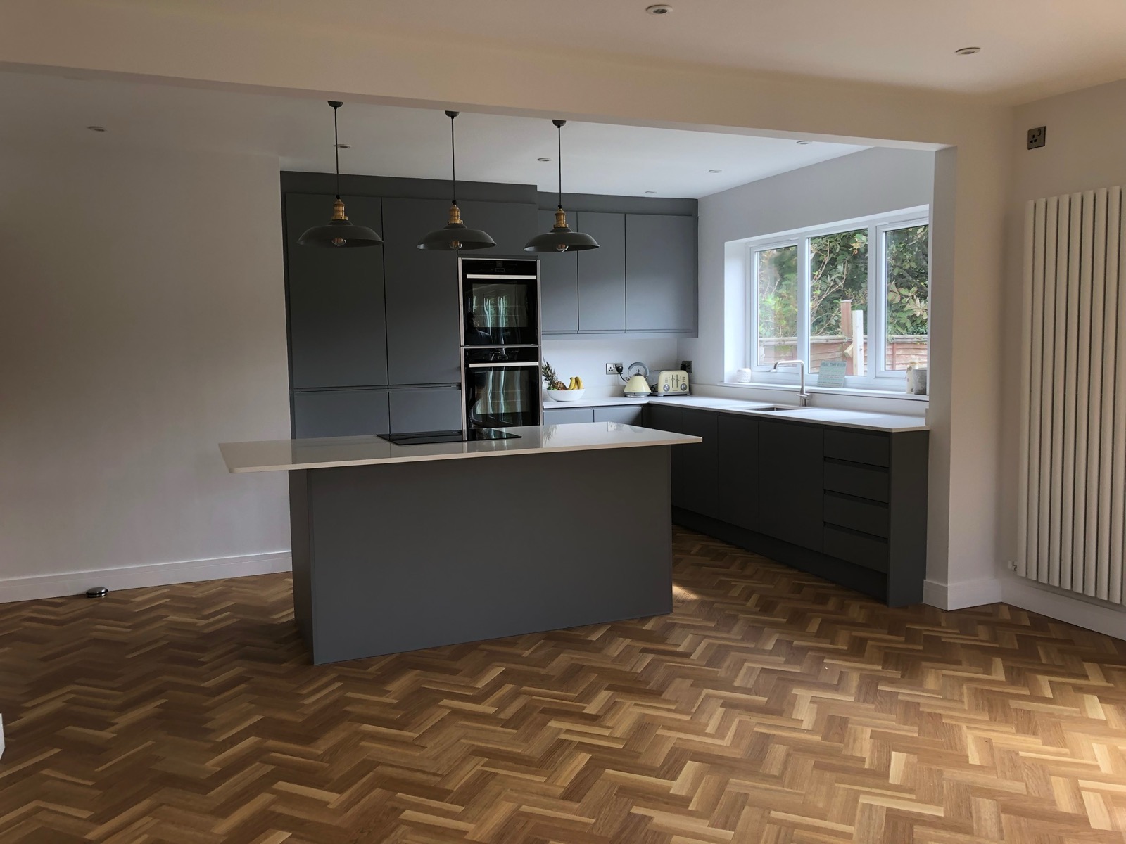 Kitchen anthracite herringbone floor pendant lights, made and fitted by Sussex Design Interiors