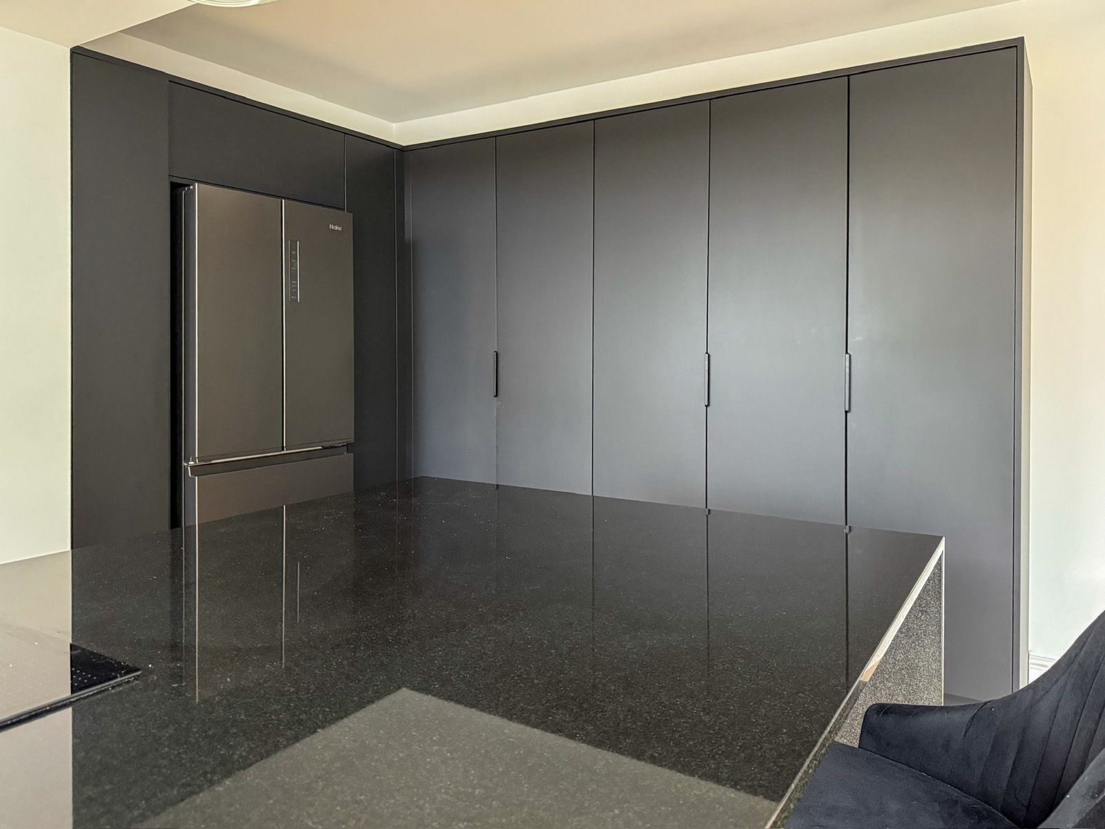 Kitchen anthracite tall units fridge freezer marble island, made and fitted by Sussex Design Interiors