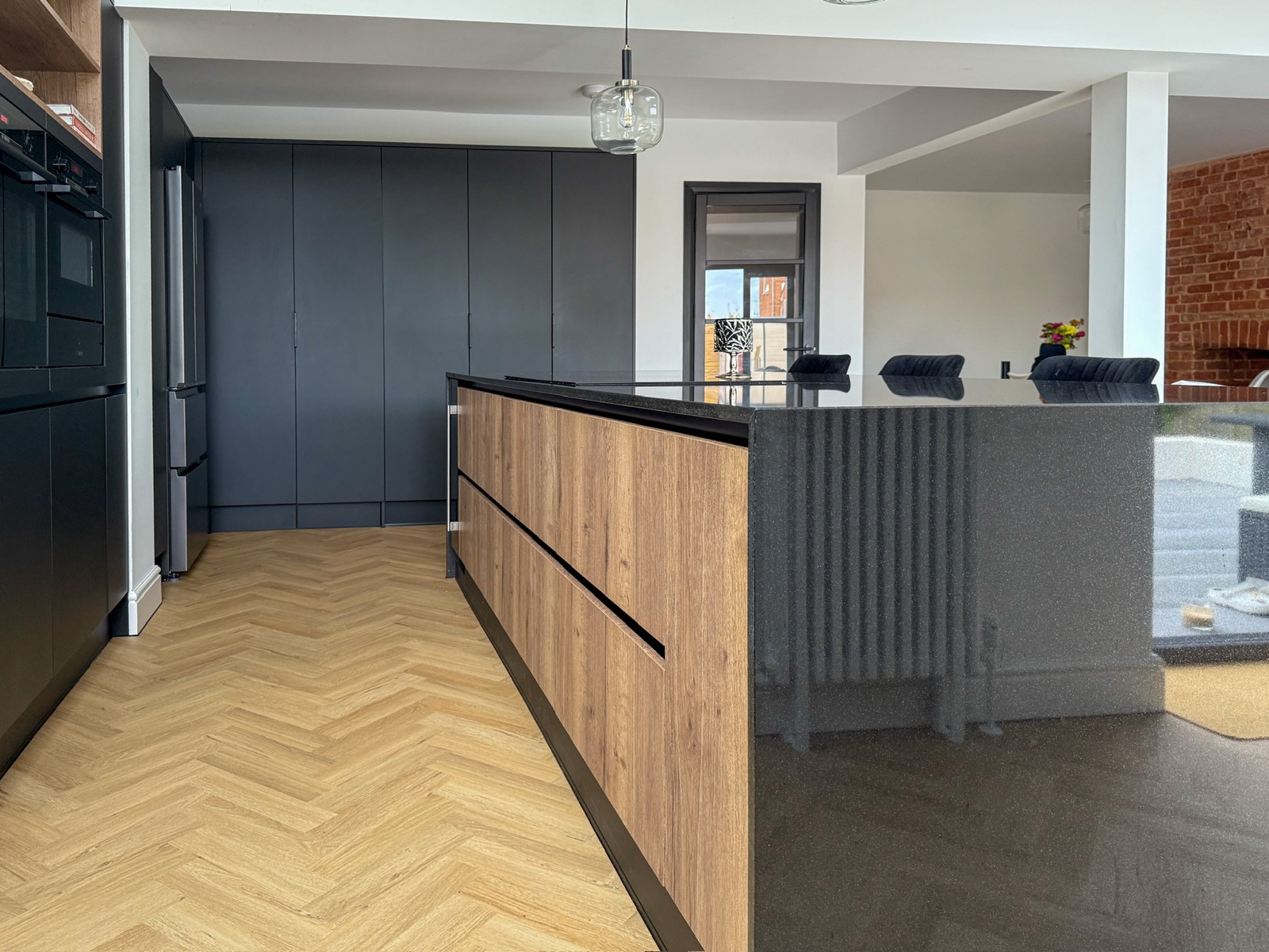Kitchen black oak island herringbone floor radiator, made and fitted by Sussex Design Interiors