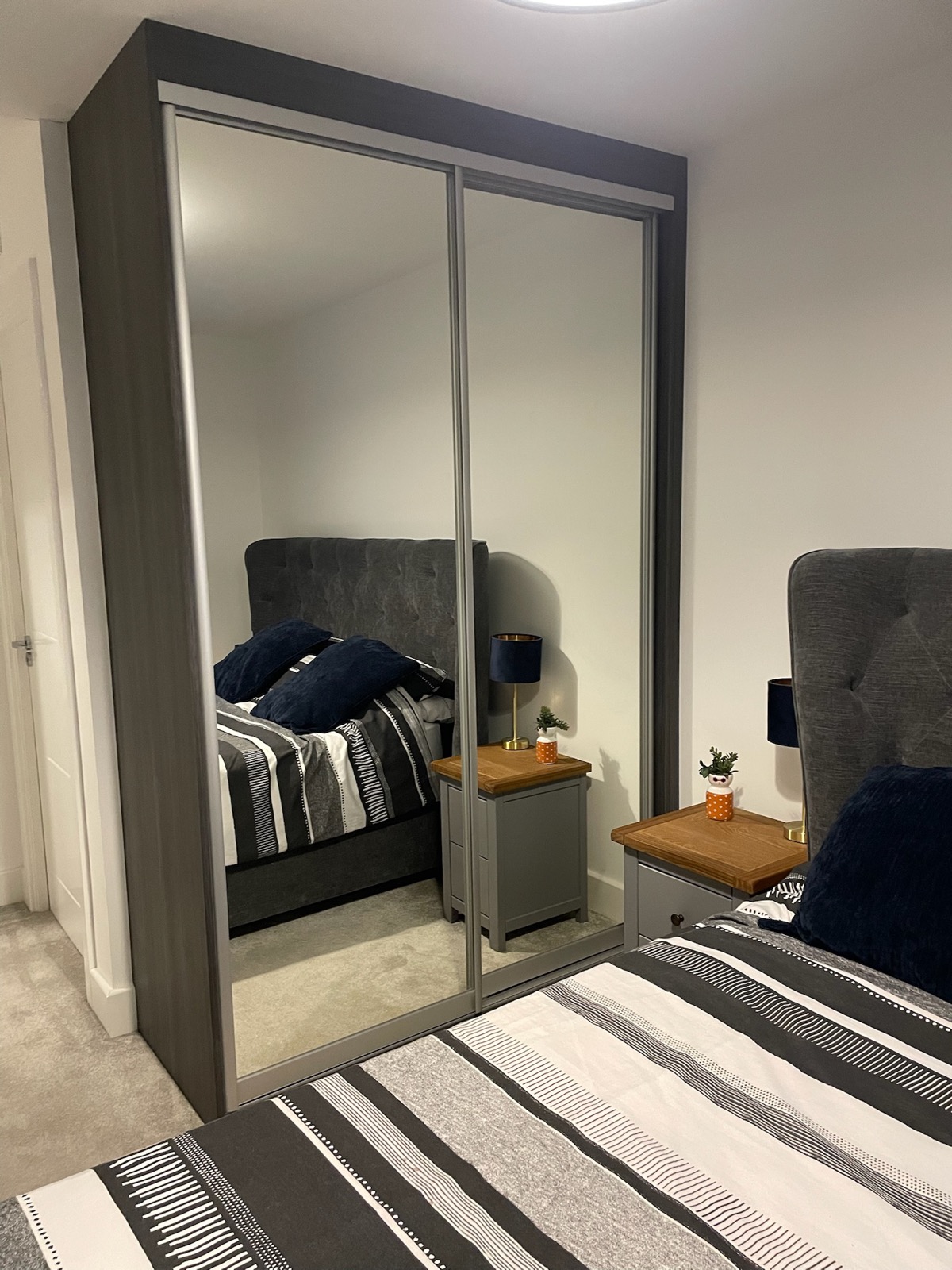 Wardrobe mirror sliding doors bedroom headboard, made and fitted by Sussex Design Interiors