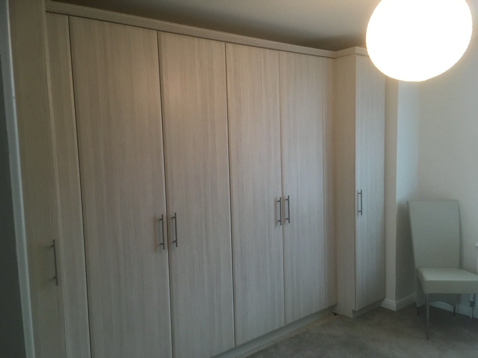 Wardrobe oak fitted hinged doors, made and fitted by Sussex Design Interiors