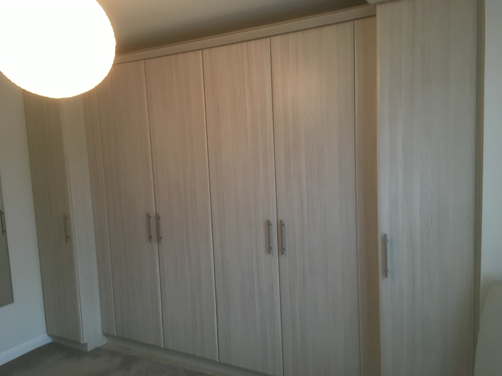 Wardrobe oak fitted hinged doors, made and fitted by Sussex Design Interiors